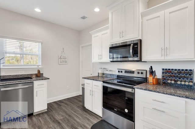 kitchen featuring visible vents, recessed lighting, white cabinetry, and stainless steel appliances