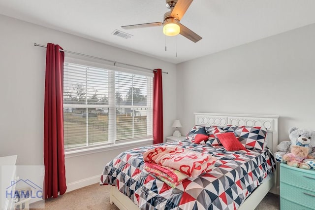 bedroom with visible vents, ceiling fan, baseboards, and carpet