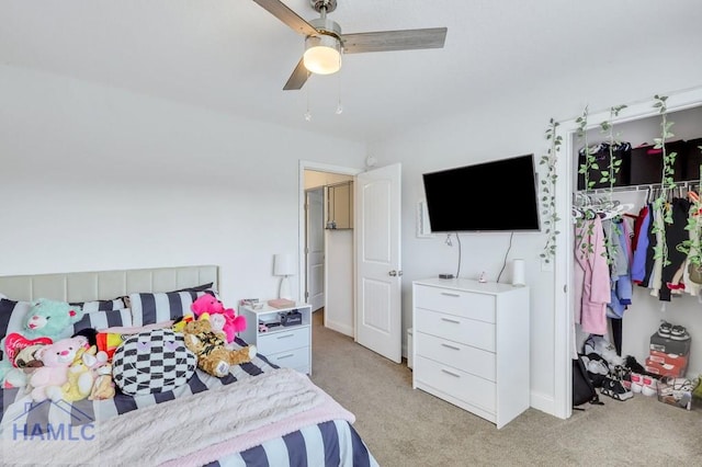 bedroom featuring light colored carpet and ceiling fan