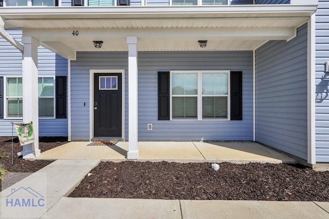 doorway to property featuring a porch