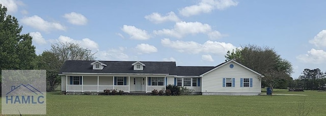 view of front of home featuring covered porch and a front lawn
