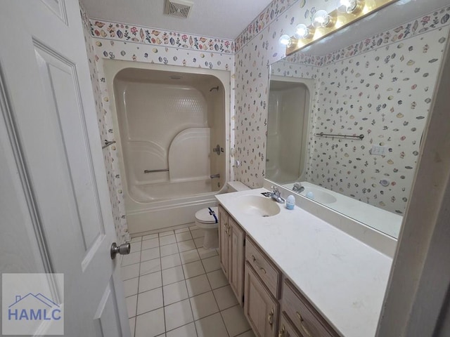bathroom featuring tile patterned floors, toilet, vanity, visible vents, and wallpapered walls