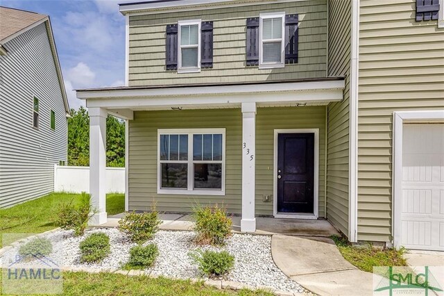 doorway to property with covered porch
