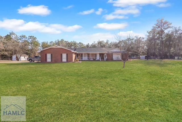 single story home with a front yard and a porch