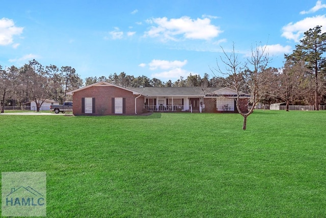 view of front of house with a porch and a front lawn