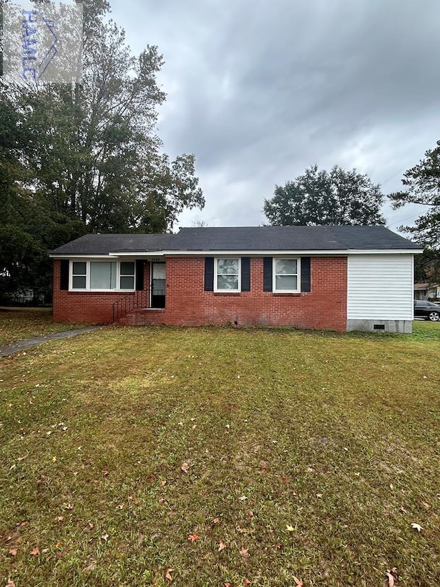 ranch-style house with crawl space, brick siding, and a front lawn