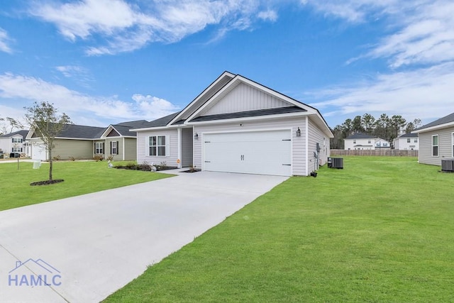 ranch-style home featuring a garage, fence, concrete driveway, board and batten siding, and a front yard