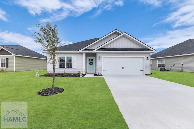 ranch-style home featuring a garage, driveway, board and batten siding, and a front yard