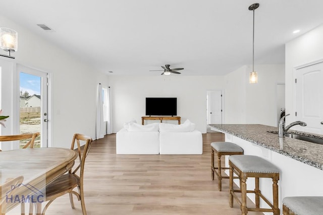 dining area with a ceiling fan, light wood-type flooring, visible vents, and recessed lighting