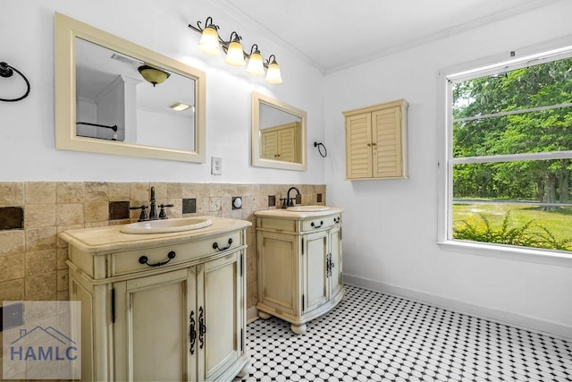 443 Martin Rd, Midway, GA 31320 - full bath with two vanities, tile walls, crown molding, and a wainscoted wall