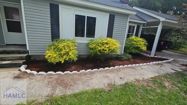 443 Martin Rd, Midway, GA 31320 - view of side of property featuring roof with shingles and an attached carport