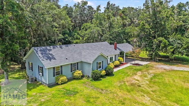 443 Martin Rd, Midway, GA 31320 - view of front of house featuring a shingled roof, a chimney, a front yard, and dirt driveway
