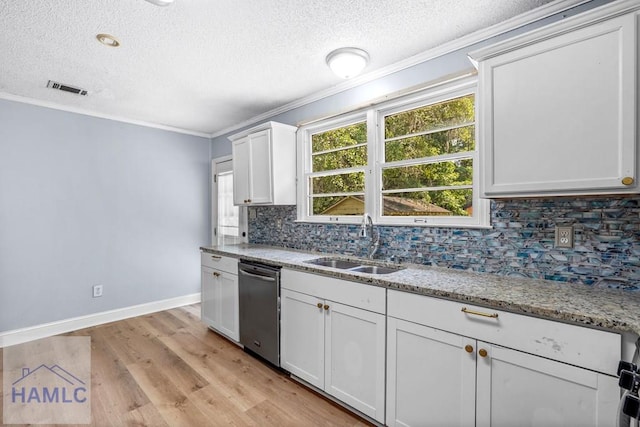 443 Martin Rd, Midway, GA 31320 - kitchen with stainless steel dishwasher, crown molding, a textured ceiling, backsplash, and light wood-type flooring