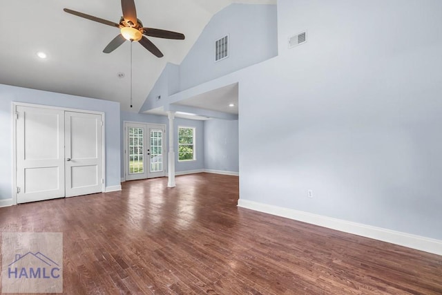 443 Martin Rd, Midway, GA 31320 - unfurnished living room featuring a ceiling fan, wood finished floors, ornate columns, high vaulted ceiling, and french doors