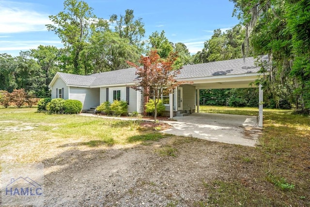 443 Martin Rd, Midway, GA 31320 - ranch-style home with driveway, a carport, and a front lawn