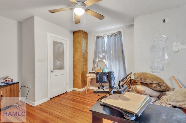 interior space featuring hardwood / wood-style flooring and ceiling fan