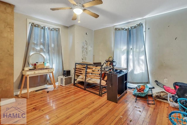 misc room featuring hardwood / wood-style flooring and ceiling fan