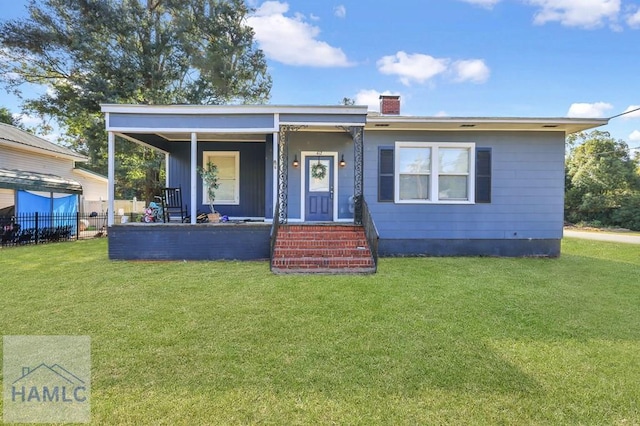 bungalow featuring a front lawn and a porch