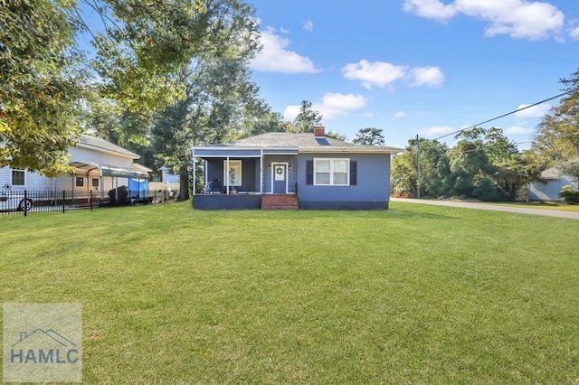 bungalow-style home with covered porch and a front lawn