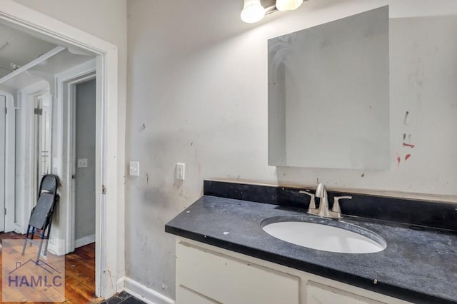 bathroom with hardwood / wood-style floors and vanity