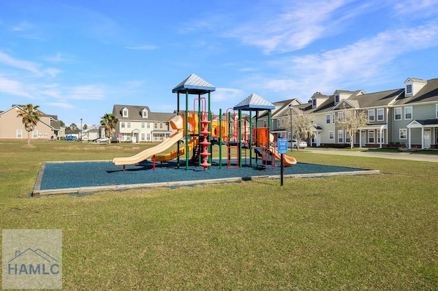 community playground with a residential view and a lawn