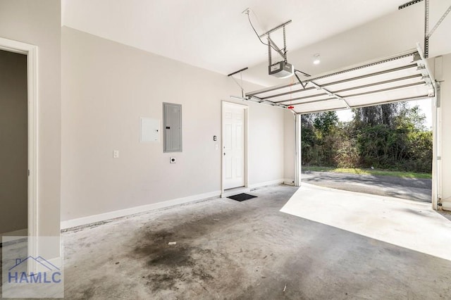 garage featuring electric panel, baseboards, and a garage door opener