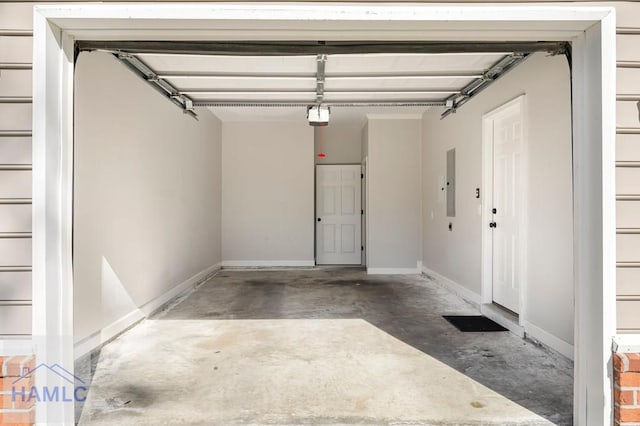 garage with electric panel, a garage door opener, and baseboards