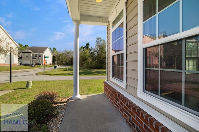 view of patio with a residential view and covered porch