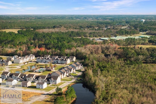 birds eye view of property with a forest view and a residential view