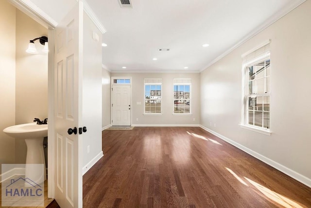 hall featuring a wealth of natural light, recessed lighting, baseboards, and ornamental molding