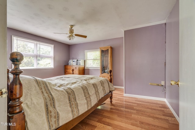 bedroom featuring ceiling fan and light hardwood / wood-style floors