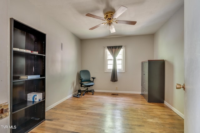 sitting room featuring light hardwood / wood-style floors and ceiling fan