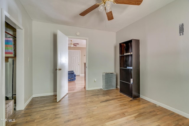 unfurnished bedroom featuring light hardwood / wood-style flooring and ceiling fan