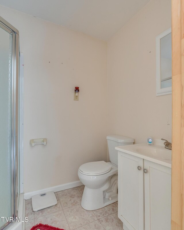 bathroom with tile patterned floors, vanity, and toilet