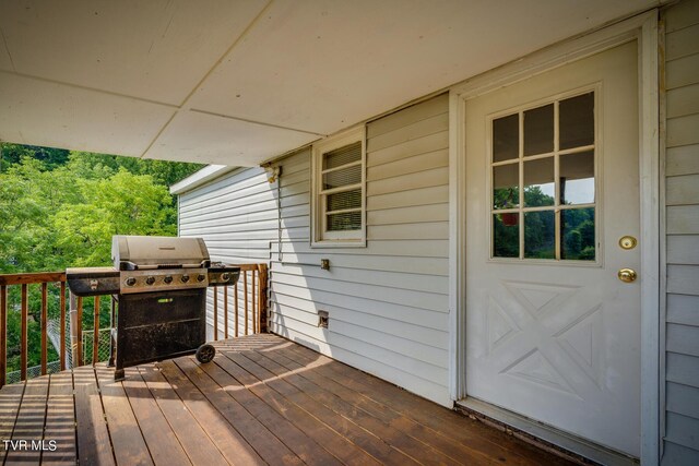 wooden deck with area for grilling