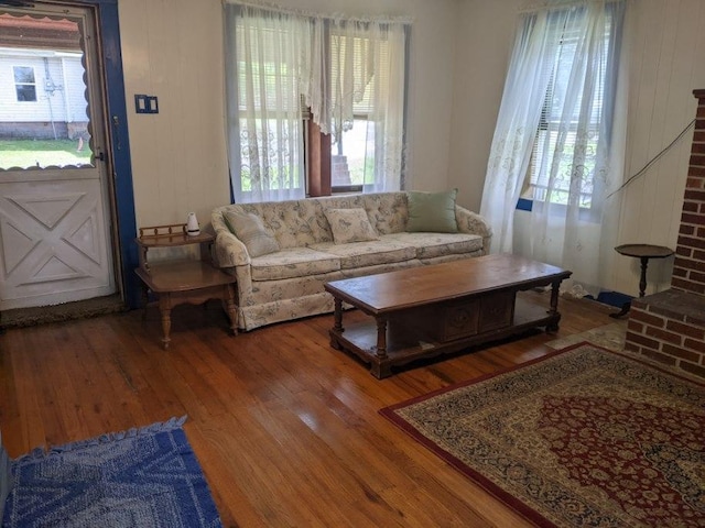 living room with hardwood / wood-style floors and a healthy amount of sunlight