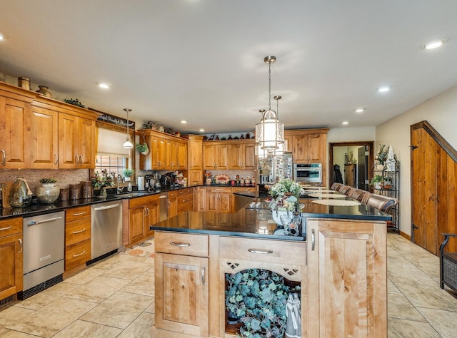 kitchen with tasteful backsplash, light tile floors, stainless steel appliances, a center island, and hanging light fixtures