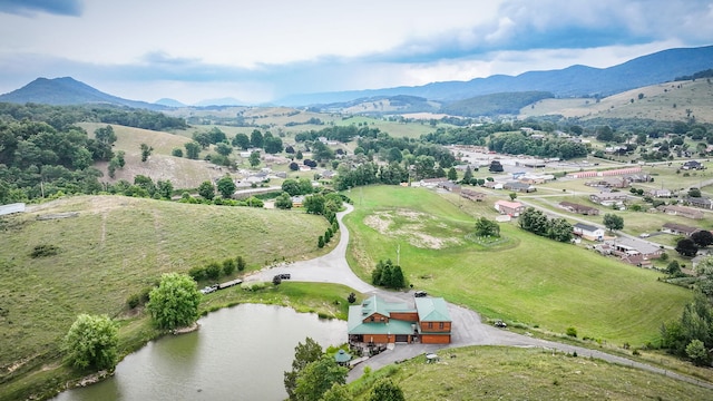 bird's eye view featuring a water and mountain view