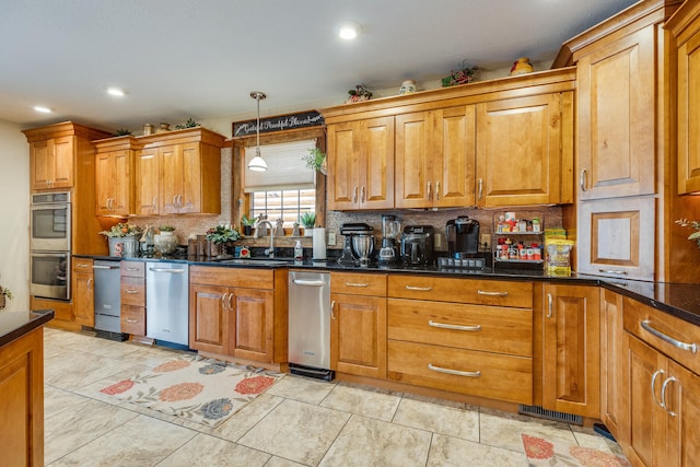 kitchen featuring backsplash, light tile flooring, sink, dark stone counters, and pendant lighting