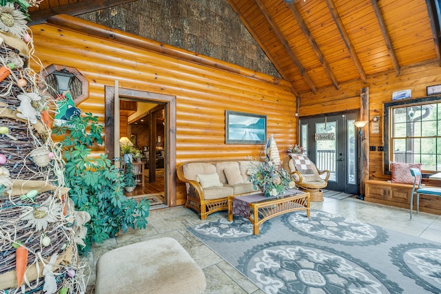 tiled living room with a healthy amount of sunlight, log walls, and high vaulted ceiling