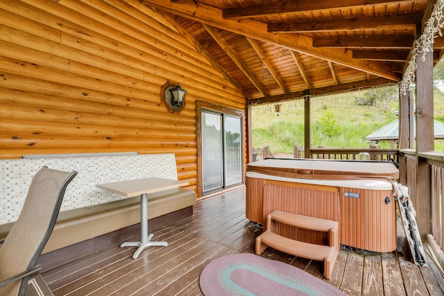 wooden terrace featuring a hot tub