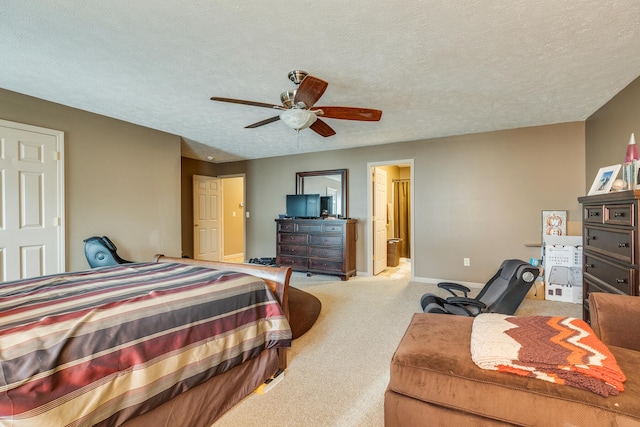 bedroom with carpet flooring, ceiling fan, and a textured ceiling