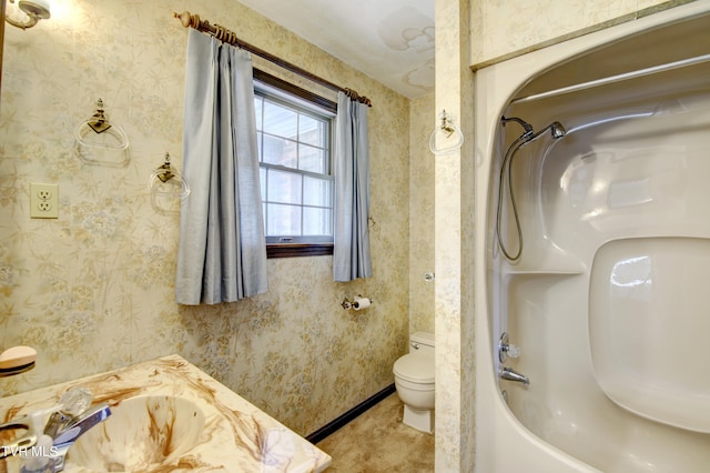 bathroom with toilet and shower / bath combination