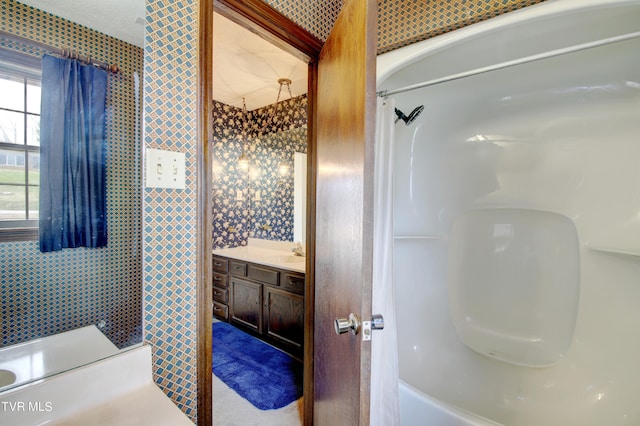 bathroom with vanity and shower / bath combo