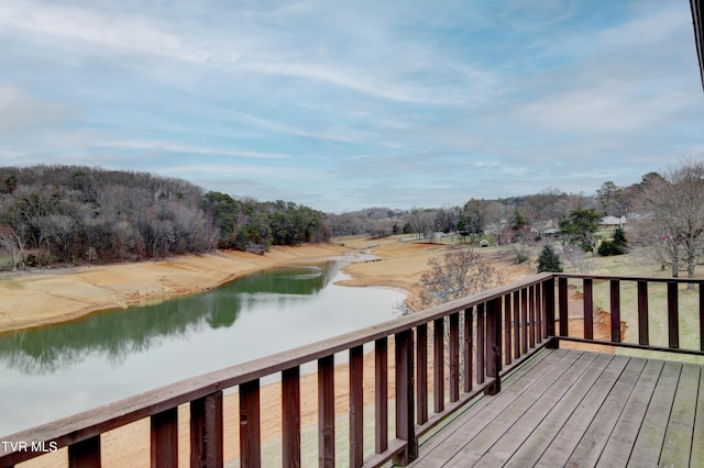 wooden terrace with a water view