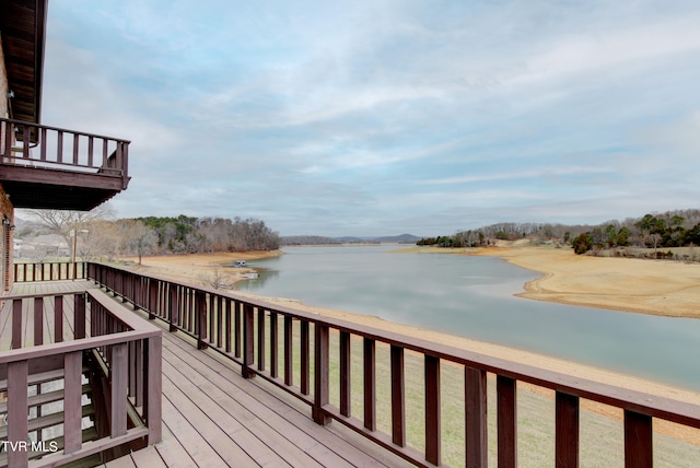 wooden deck featuring a water view