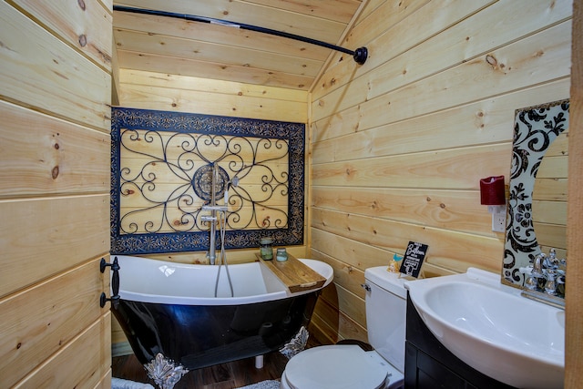 bathroom with wooden walls, vaulted ceiling, toilet, and wood ceiling