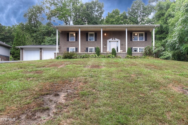 split foyer home with a front lawn