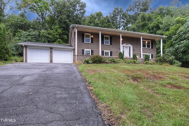 raised ranch featuring a front lawn