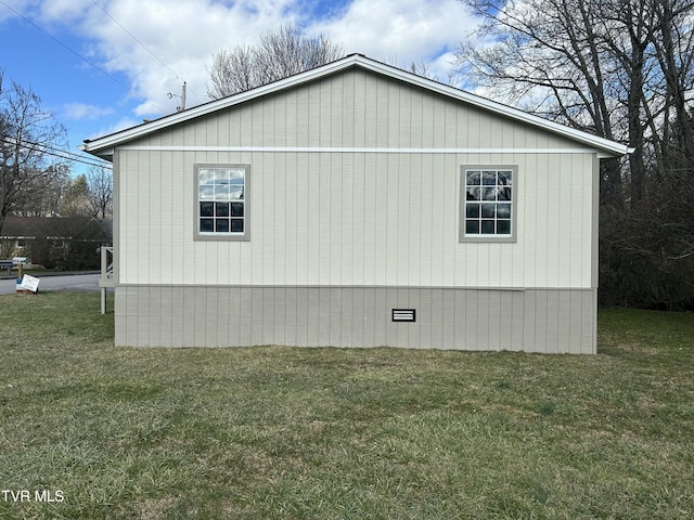 view of property exterior with a lawn